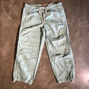 Mint green cargo capris with zippers and ties